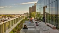Students lounging on Columbia Nursing rooftop patio.